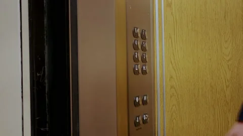 Man's hand presses elevator button to move up. Close up footage 스톡 동영상 166555462