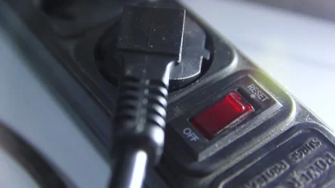 Man's hand presses the power button of the socket adapter Vídeos de archivo 223363146