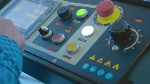 A man's hand presses various buttons and turns knobs on the control panel  Stock-Footage 333416916