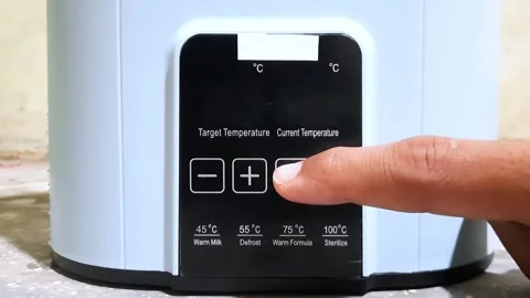 A man's hand pressing a button to turn on the sterilizer Stock Footage 306291997