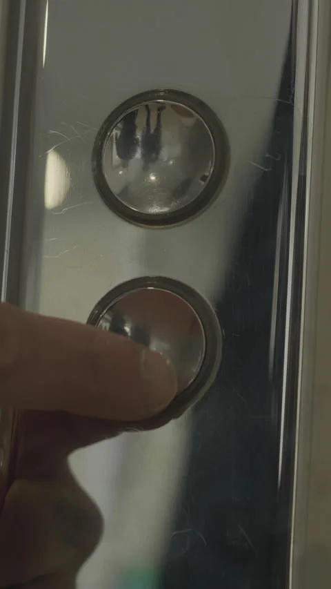 Mans hand pressing elevator down button. HDR. Close up of male finger getting Stock Footage 285710708