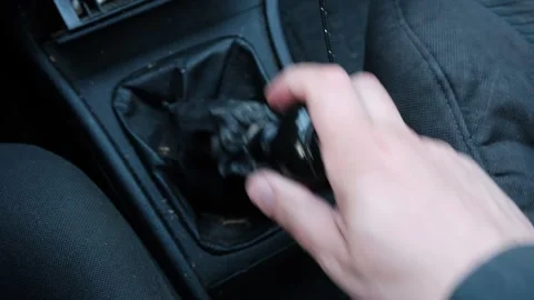 A man's hand pulls the gear shift knob in an old car. Vehicle malfunction. .. Stock Footage 243774918