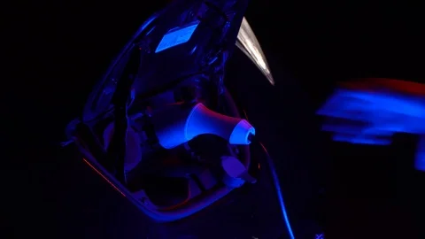 A man's hand pulls out a gun to charge an electric car Stock Footage 126657645