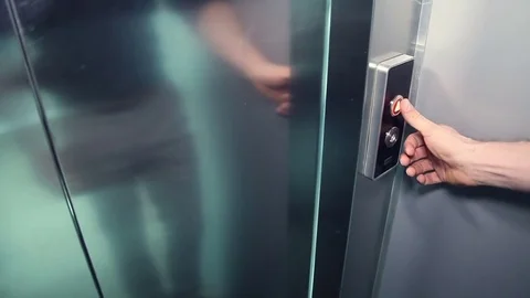 Man's hand push the elevator button Stock Footage 73469843