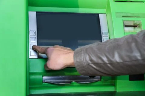 A man's hand is pushing the button. Stock Photos