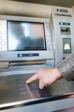 A man's hand is pushing the buttons. Stock Photos