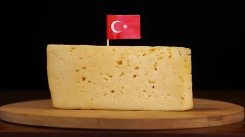 Man's hand put small in size toothpick with turkish flag on cheese. Stock Footage 159817105