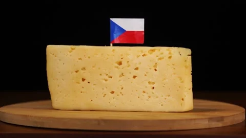 Man's hand put small in size toothpick with czech flag on cheese. Stock Footage 159820683