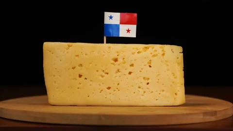 Man's hand put small in size toothpick with panamanian flag on cheese. Stock Footage 159827127