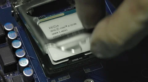 Man's Hand Puts Intel I5 Processor Into Motherboard Socket Stock Footage 58575054