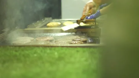 Man's hand puts meat on barbecue grid outdoors Stock Footage 86511484