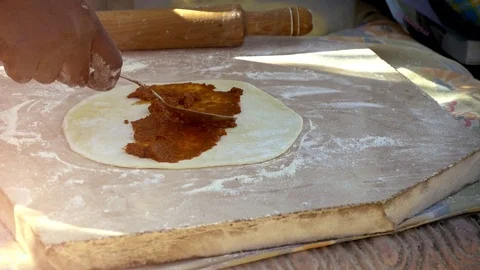 Man's Hand Puts Sauce On Dough For Baking Traditional Dish Stock Footage 114253913