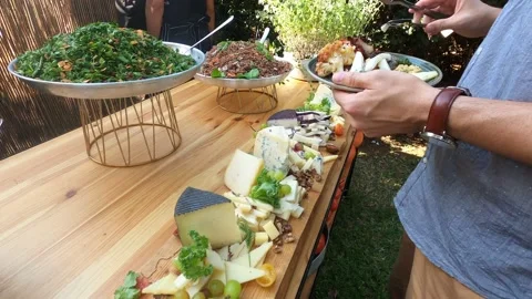 Man's hand puts sliced cheese on plate in restaurant. Stock Footage 199033866