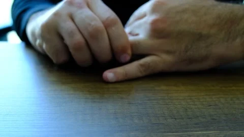 A man’s hand putting on and taking off a ring 動画素材 292035062
