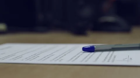 Man's hand putting down a pencil on the top of the assigned contract. Stock Footage 43088137