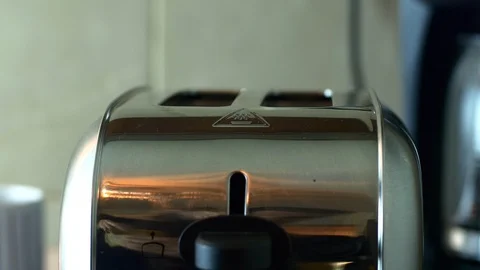 Man's Hand Putting Two Slices Of Bread In The Toaster, Morning Ritual Stock Footage 85556655