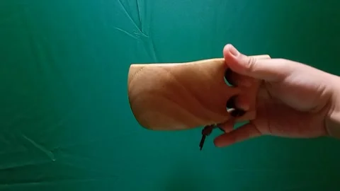 A man's hand raise a cup of coffee on a green screen background Stock Footage 340357410