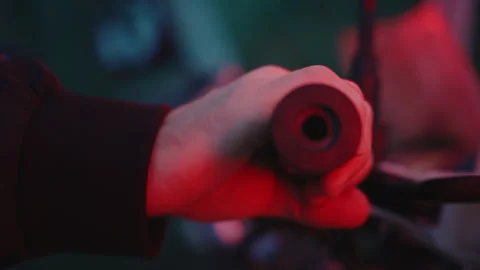 Man's hand revs motorcycle, close-up of handlebar, slow-mo, night Stock Footage 255295470