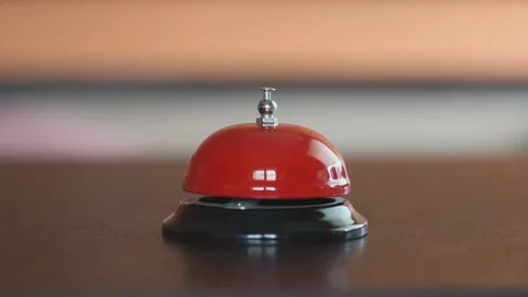 A man's hand rings the bell at the front desk, close-up, Stock Footage 153654085