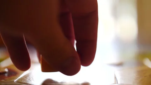Man's hand rolling dice in slow motion close up playing a game board game Stock-Footage 207340499