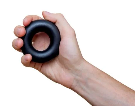 Man's hand with rubber ring (hand gripper). Sport and equipment. Isolated. Stock Photos