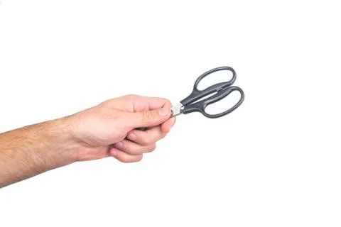 Mans hand with scissors isolated on a white background. Stock Photos