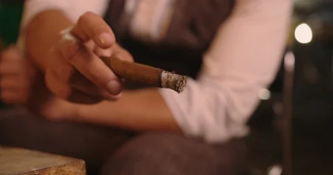Mans hand shakes off the ashes of cigar Stock Footage 117675535