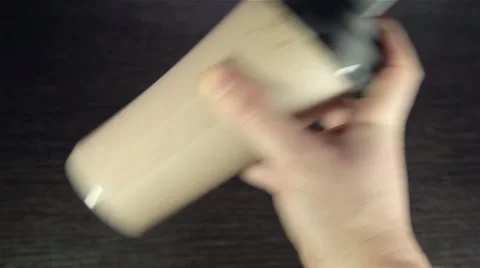 Man's hand shaking whey protein shake in the plastic shaker Stock Footage 35587338
