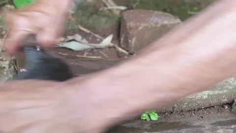 A mans hand sharpening a machete on a sharpening stone Stock Footage 312095582