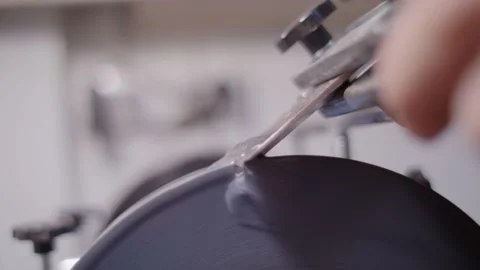 Man's hand sharpens chisel on rotating grinding stone. Stock-Footage 151127373