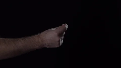 Man's hand shows finger single clap gesture on black background. Stock Footage 124846867