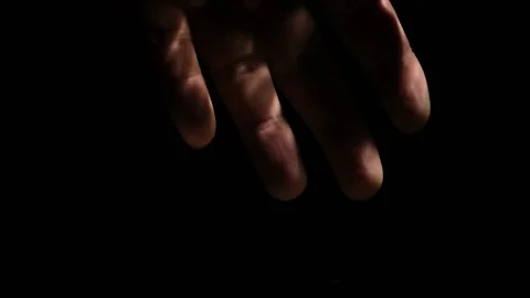 Man's hand smoothly descends into dark deep sea depths, close-up. Stock Footage 198617504