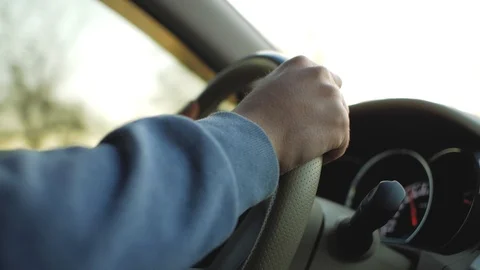 Man's hand on the steering wheel of a car. man driving a car Stock Footage 103217610