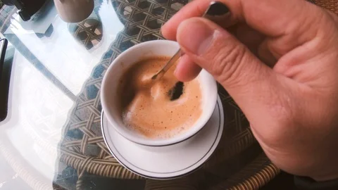 A Man's Hand Stirring Coffee Stock Footage 104884252