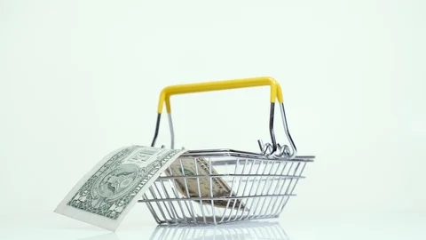 Man's hand takes and puts one dollar in a supermarket basket Stock Footage 124477232