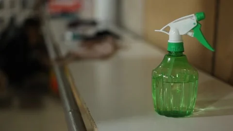 A man's hand takes a plastic pumping bottle sanitizer from the shelf. Stock Footage 168561160