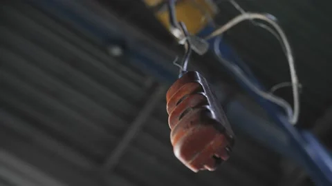 A man's hand takes the remote control of the crane in the workshop room, close Vídeos de archivo 148430055