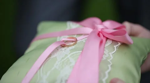 Man's hand takes the wedding ring. slow-motion Stock Footage 47729608