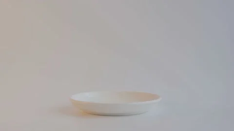 Man's hand takes a white ceramic cup with coffee or tea and puts it back on Видео 198477107
