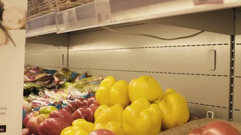Man's hand taking bell pepper in a supermarket Stock Footage 80169154
