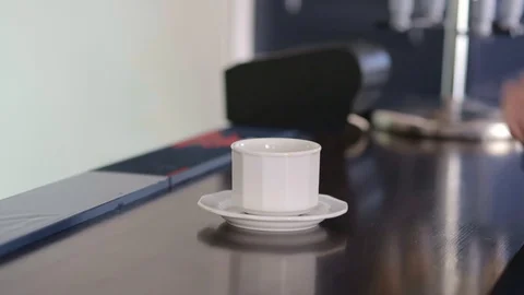 Mans hand taking a cup of coffee out of the shot. Stock Footage 130042886