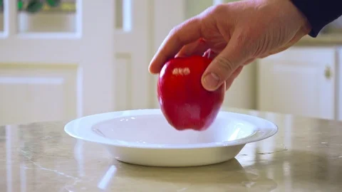 Man's hand taking touching apple Video stock 108586019
