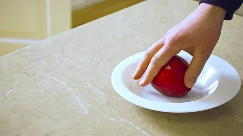 Man's hand taking touching apple Stockbeeldmateriaal 108586125