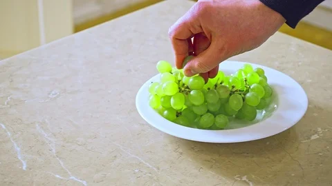 Man's hand taking touching grape Stock-Footage 108585973