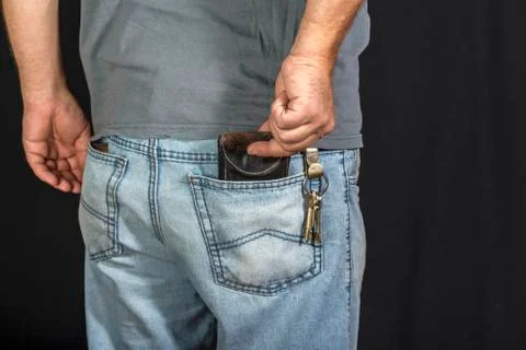Man's hand taking wallet Stock Photos