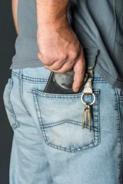 Man's hand taking wallet Stock Photos