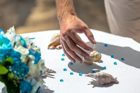 Mans hand taking wedding ring Stock Photos