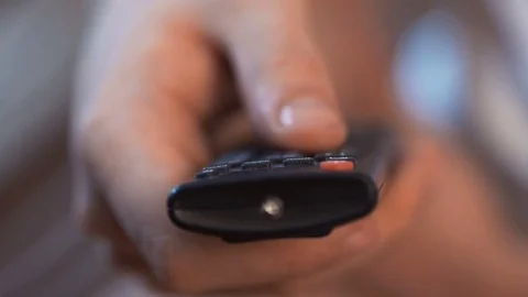 Man's hand with television remote control. Stock Footage 69836095