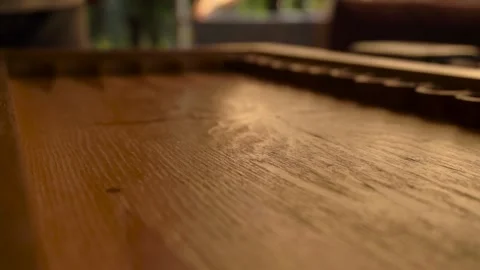 A man's hand throws colorful dice on a wooden backgammon board Stock Footage 161624962