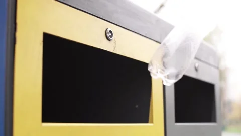 A man's hand throws a container for recycling plastic bottles, garbage sorting Stock Footage 265236499